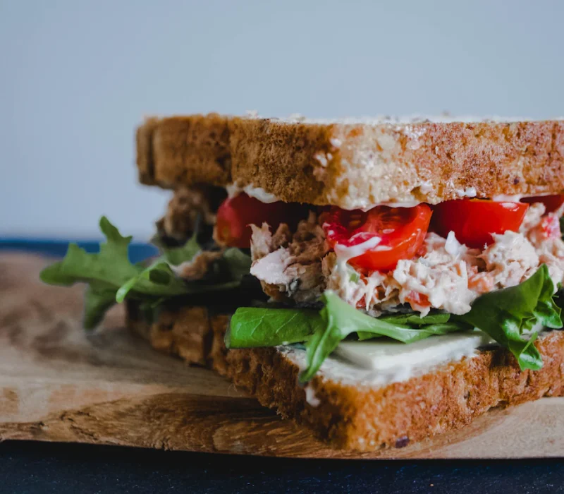 Greek yogurt chicken salad sandwich with lettuce on whole grain bread