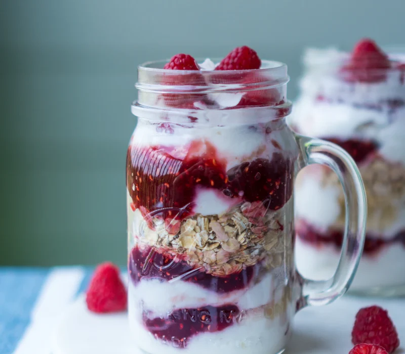 High protein overnight oats layered in jars with fresh berries